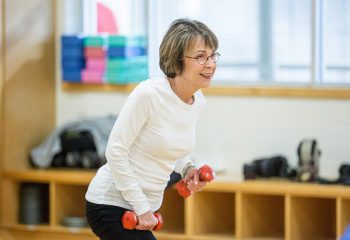 lady using light hand weights