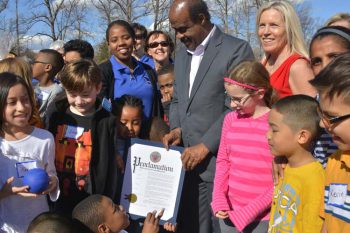 Mayor with Catch Healthy Habits Day plaque