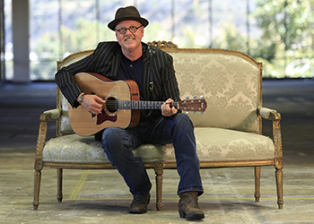 Peter Bolland, San Diego Oasis Instructor playing guitar