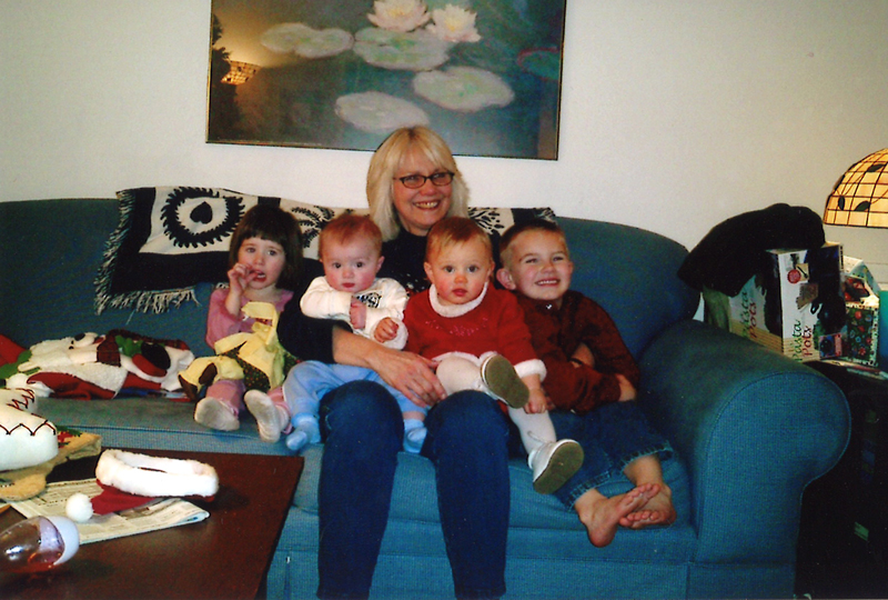 Jeanne Foster, National Tutoring Manager for Oasis, and Four grandchildren