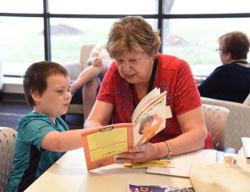 Tutor reading with child