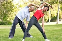 Couple stretching in the park