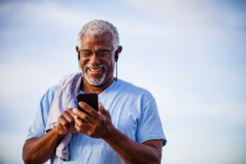 Man enjoying audiobook on his smartphone