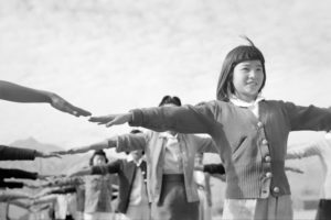 "Ansel Adams: Manzanar calisthenics, 1943" by trialsanderrors is licensed under CC BY 2.0