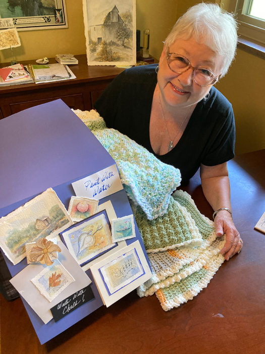 Mary Dorney Mary Dorney with some of her watercolor and crochet creations.
