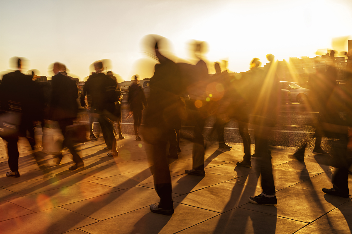Crowd of business people at sunset, London, England Crowd of business people at sunset, London, England